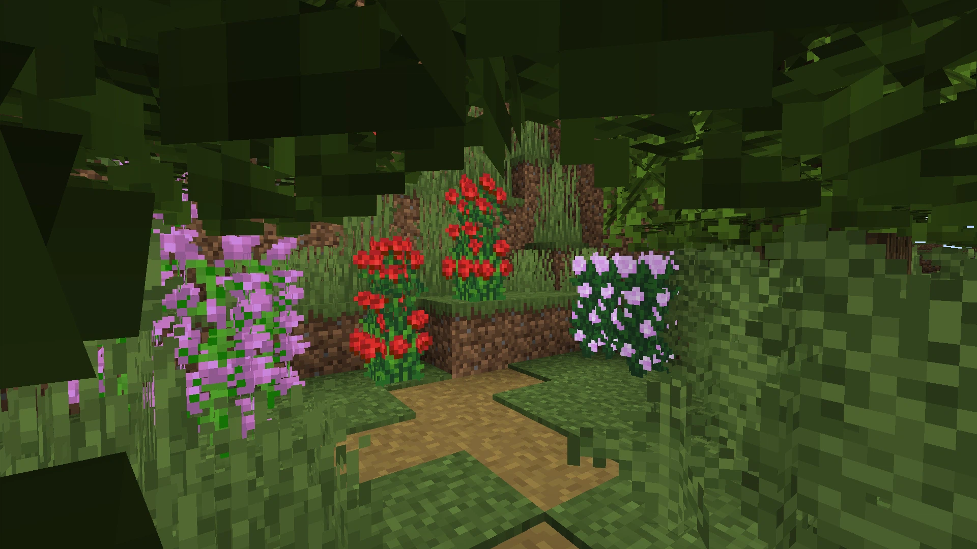 A grove of bushy grass, ferns, and tall flowers
